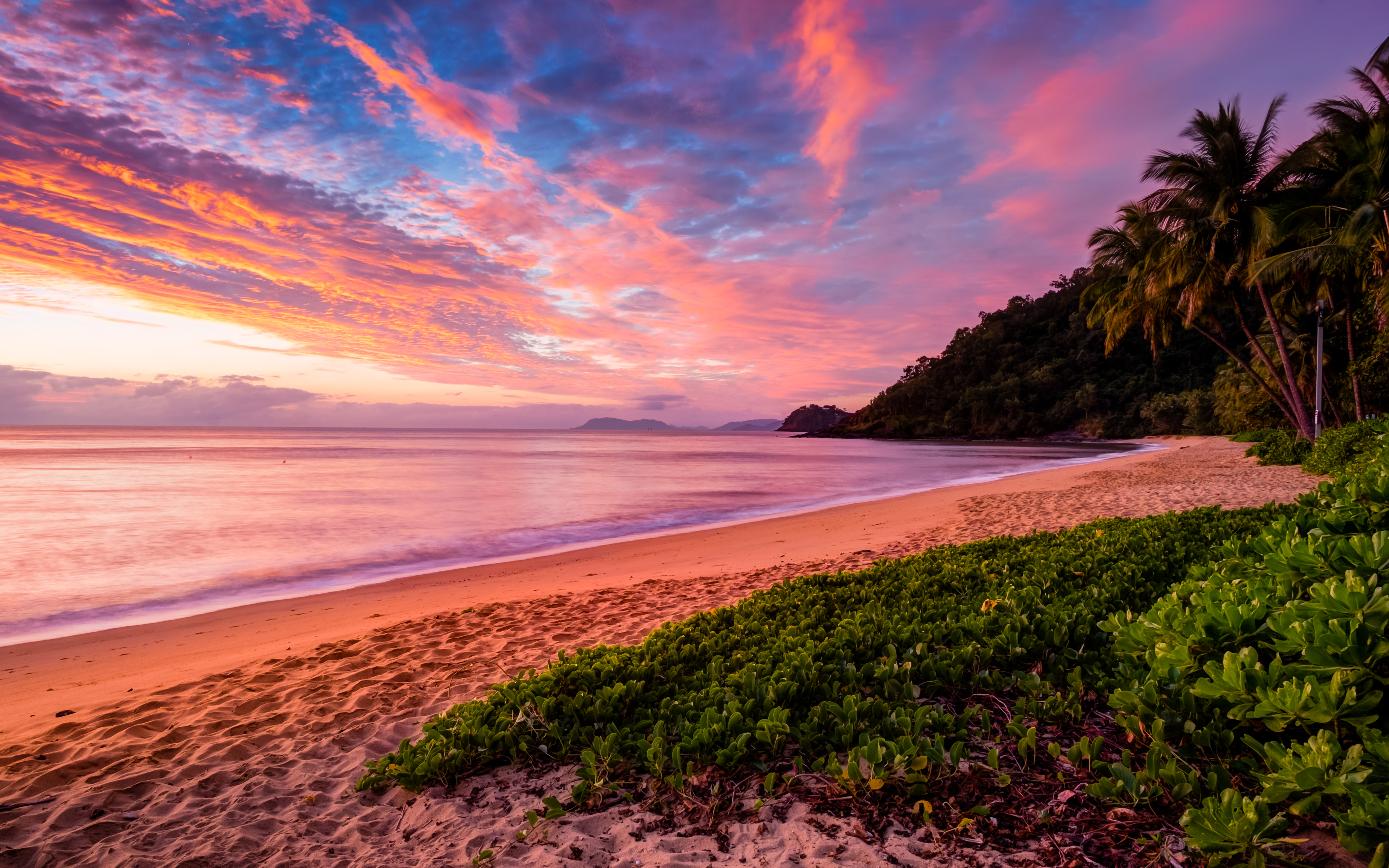 Sunrise over Trinity Beach, which is right next to a rainforest