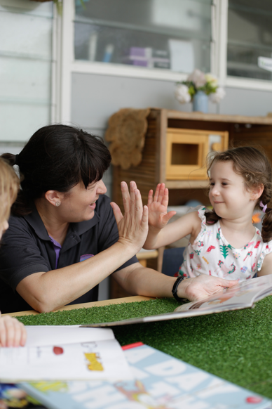 Belinda's been inspired to join the sector (pictured with children who attend her centre)